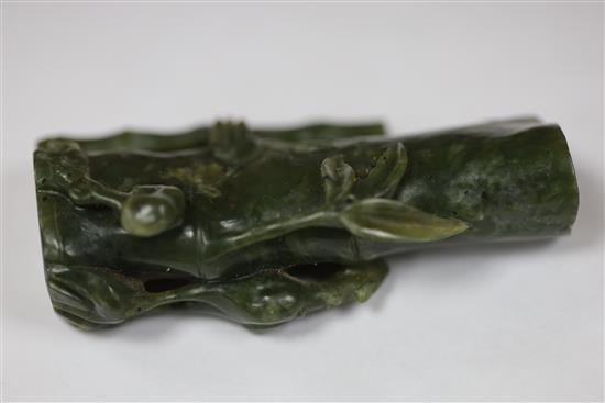 A Chinese archaistic white jade rhyton and a spinach green jade vase, 18th/19th century, H. 11cm and 8.5cm